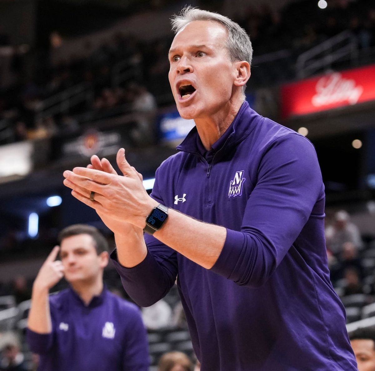 Northwestern Wildcats head coach Chris Collins calls out to an official Saturday, Dec. 20, 2025, during a 2025 Indy Classic game between the Butler Bulldogs and the Northwestern Wildcats at Gainbridge Fieldhouse in Indianapolis.