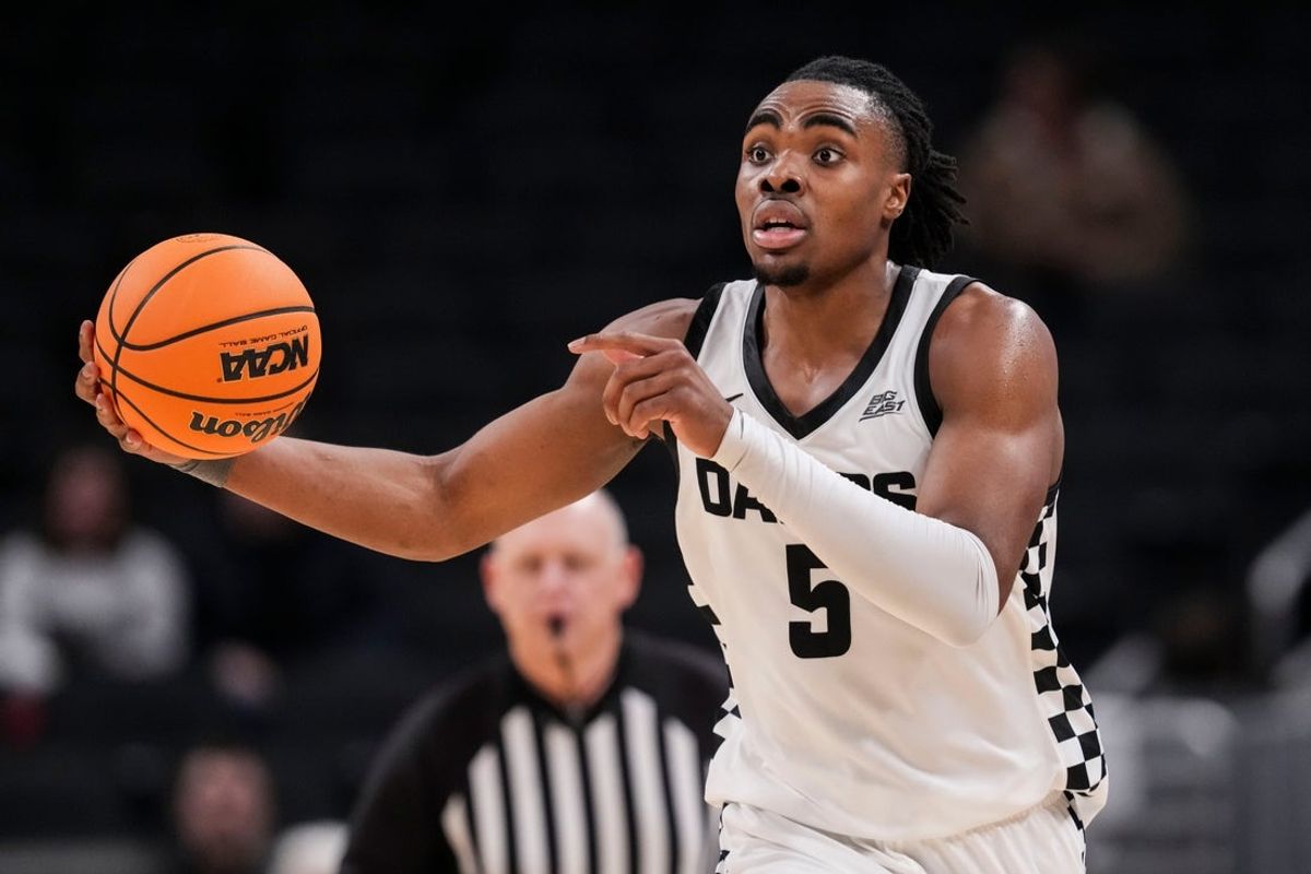 Butler Bulldogs forward Michael Ajayi (5) runs a play Saturday, Dec. 20, 2025, during a 2025 Indy Classic game between the Butler Bulldogs and the Northwestern Wildcats at Gainbridge Fieldhouse in Indianapolis.