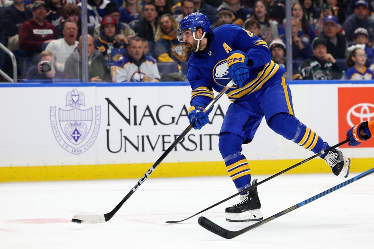 Dec 20, 2025; Buffalo, New York, USA;  Buffalo Sabres right wing Alex Tuch (89) takes a shot on goal during the second period against the New York Islanders at KeyBank Center. Mandatory Credit: Timothy T. Ludwig-Imagn Images