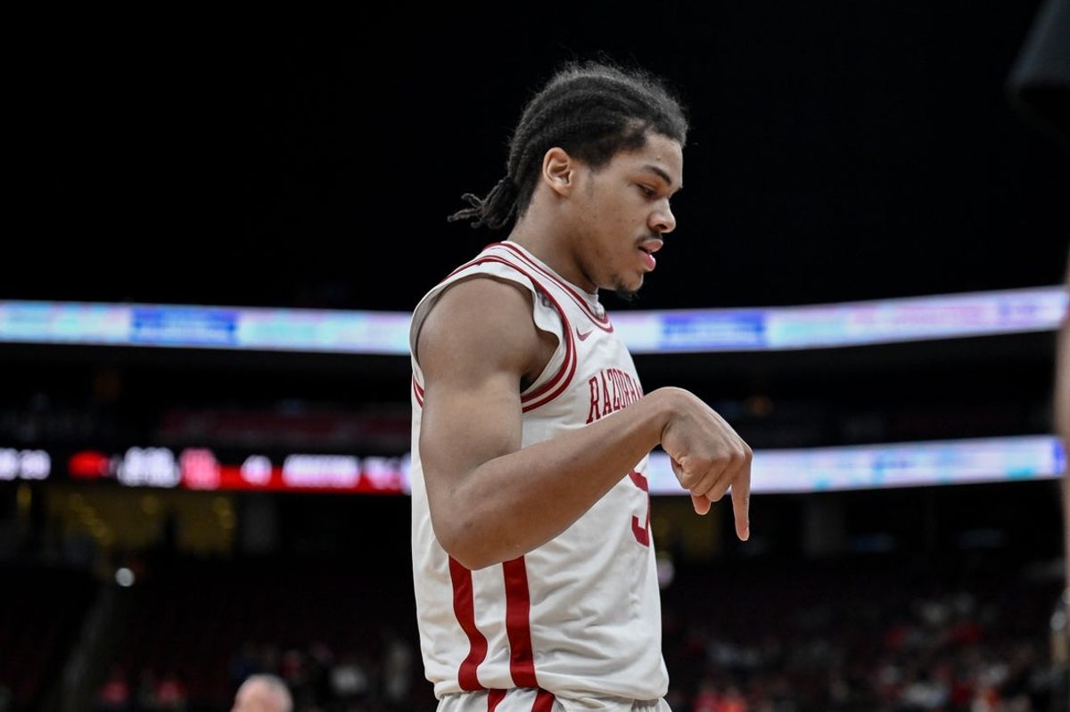 Dec 20, 2025; Newark, New Jersey, USA; Arkansas Razorbacks guard Darius Acuff Jr. (5) reacts after making a shot against the Houston Cougars during the first half at Prudential Center. Mandatory Credit: John Jones-Imagn Images