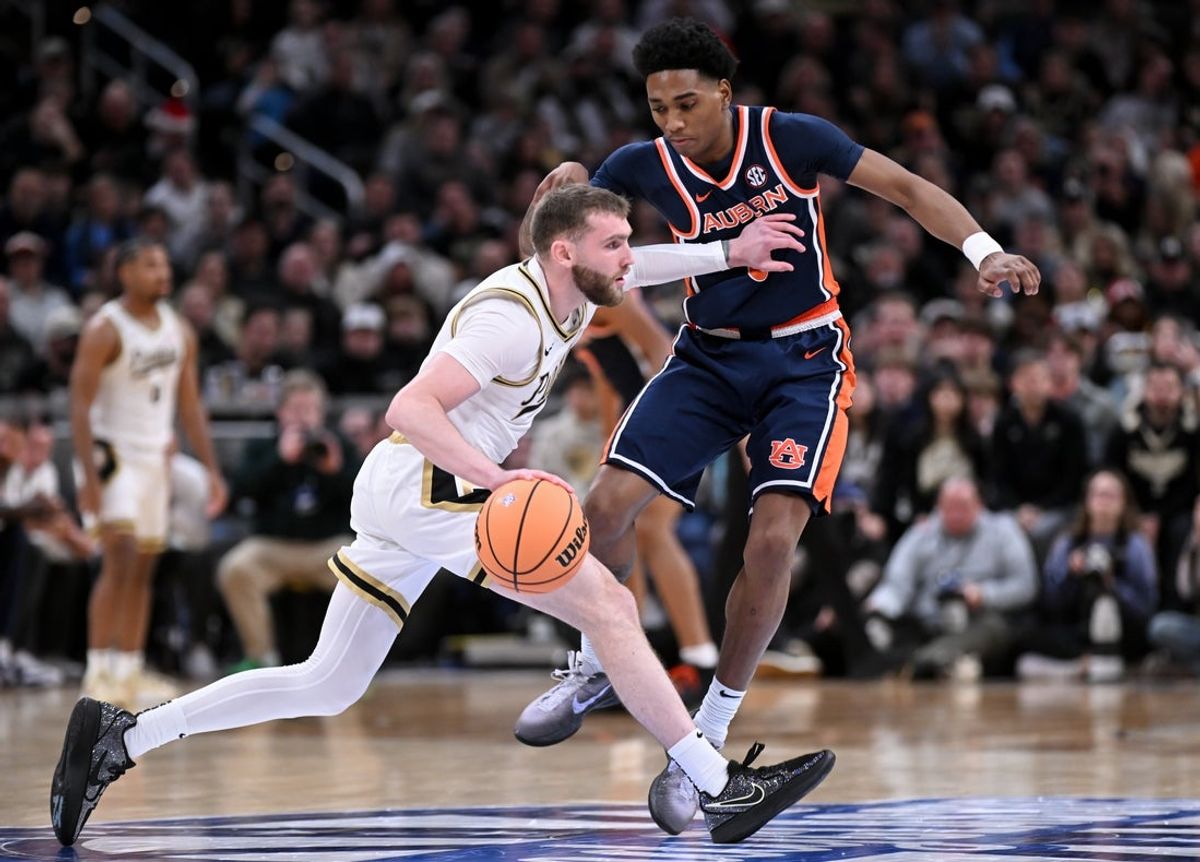 Dec 20, 2025; Indianapolis, Indiana, USA; Purdue Boilermakers guard Braden Smith (3) dribbles the ball against Auburn Tigers guard Tahaad Pettiford (0) during the first half at Gainbridge Fieldhouse. Mandatory Credit: Robert Goddin-Imagn Images
