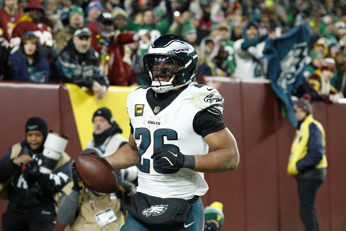 Dec 20, 2025; Landover, Maryland, USA; Philadelphia Eagles running back Saquon Barkley (26) celebrates after scoring a touchdown against the Washington Commanders in the second half at Northwest Stadium. Mandatory Credit: Geoff Burke-Imagn Images