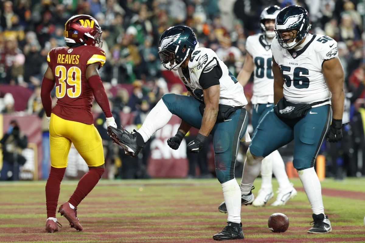 Dec 20, 2025; Landover, Maryland, USA; Philadelphia Eagles running back Saquon Barkley (26) celebrates after scoring a touchdown against the Washington Commanders in the second half at Northwest Stadium. Mandatory Credit: Geoff Burke-Imagn Images