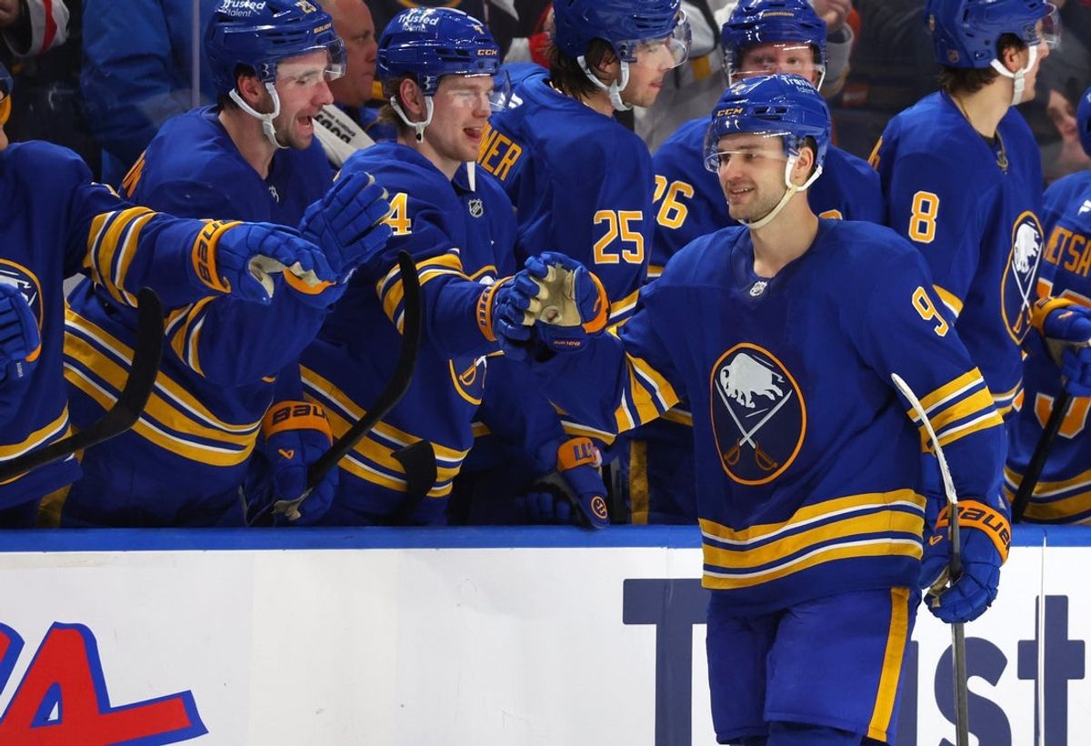 Dec 20, 2025; Buffalo, New York, USA;  Buffalo Sabres center Josh Norris (9) celebrates his game winning shootout goal against the New York Islanders at KeyBank Center. Mandatory Credit: Timothy T. Ludwig-Imagn Images