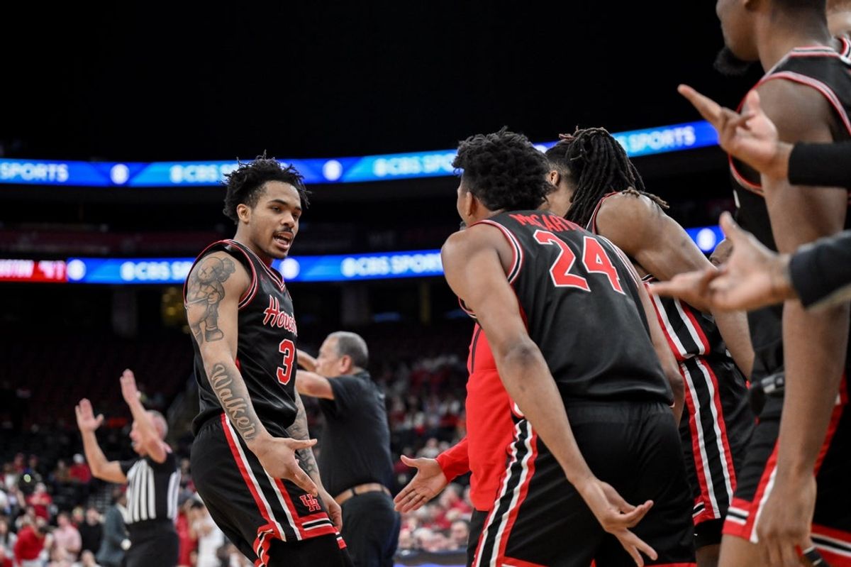 Dec 20, 2025; Newark, New Jersey, USA; Houston Cougars guard Ramon Walker Jr. (3) reacts after making a shot against the Arkansas Razorbacks during the second half at Prudential Center. Mandatory Credit: John Jones-Imagn Images