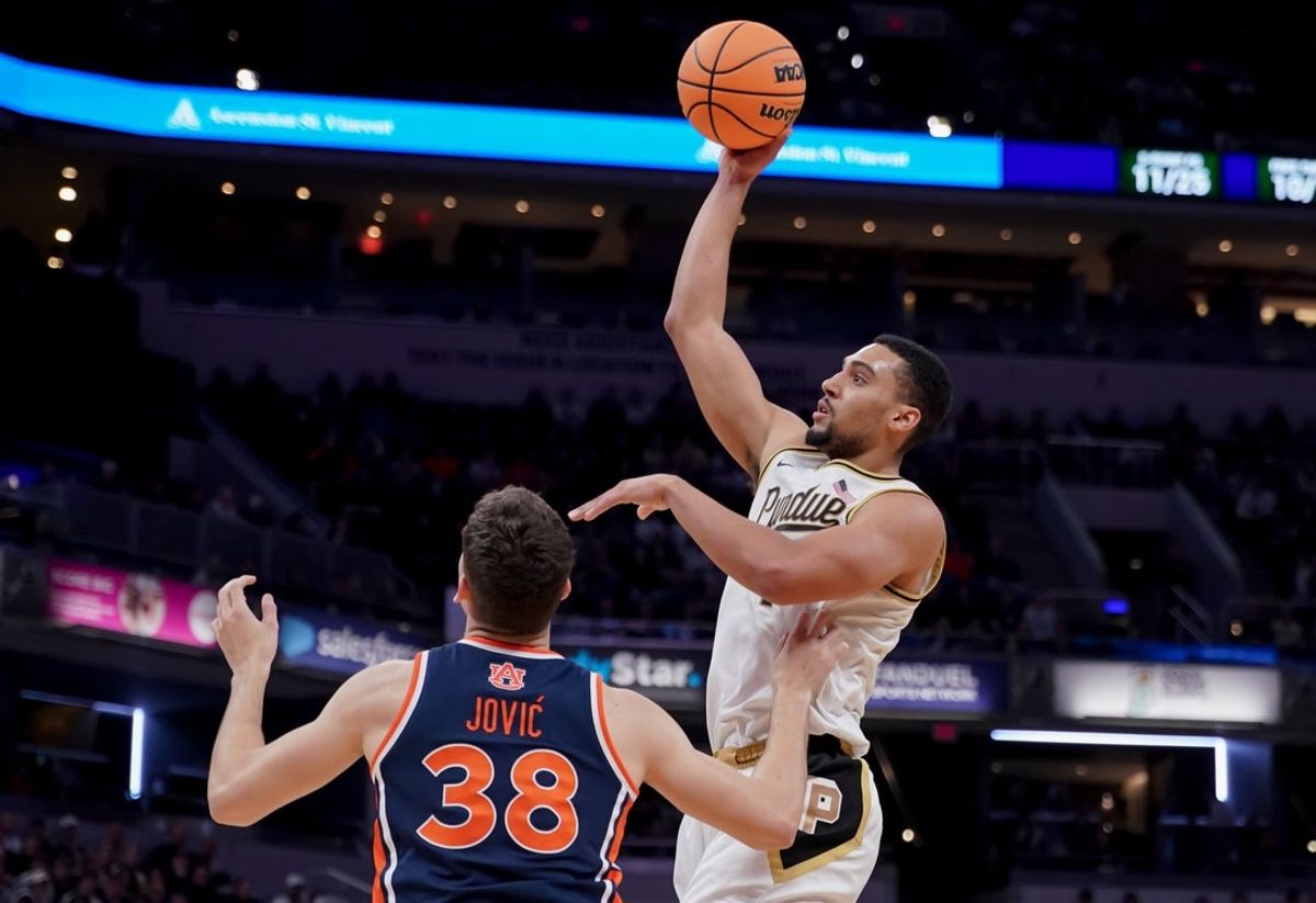 Dec 20, 2025; Indianapolis, Indiana, USA; Purdue Boilermakers forward Trey Kaufman-Renn (4) shoots the ball over Auburn Tigers forward Filip Jovic (38) during the second half at Gainbridge Fieldhouse. Mandatory Credit: Robert Goddin-Imagn Images
