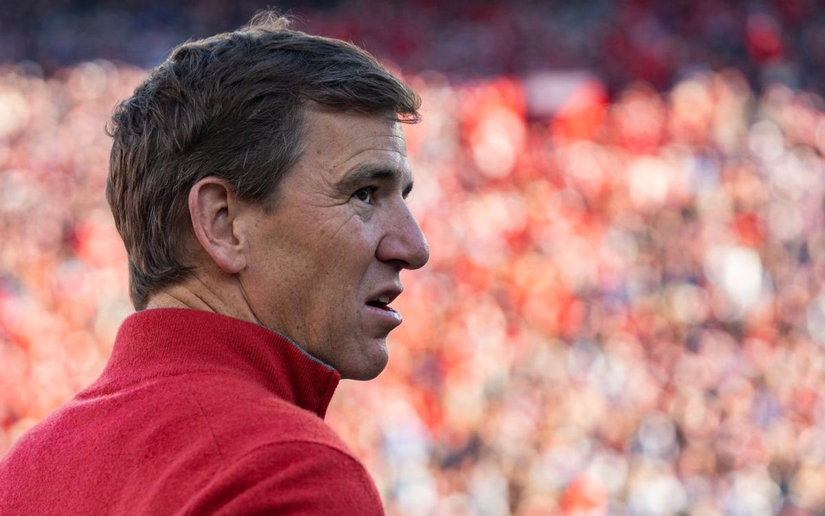 Eli Manning stands on the sideline before the first round of the College Football Playoff against Tulane at Vaught-Hemingway Stadium in Oxford, Miss., on Saturday, Dec. 20, 2025.