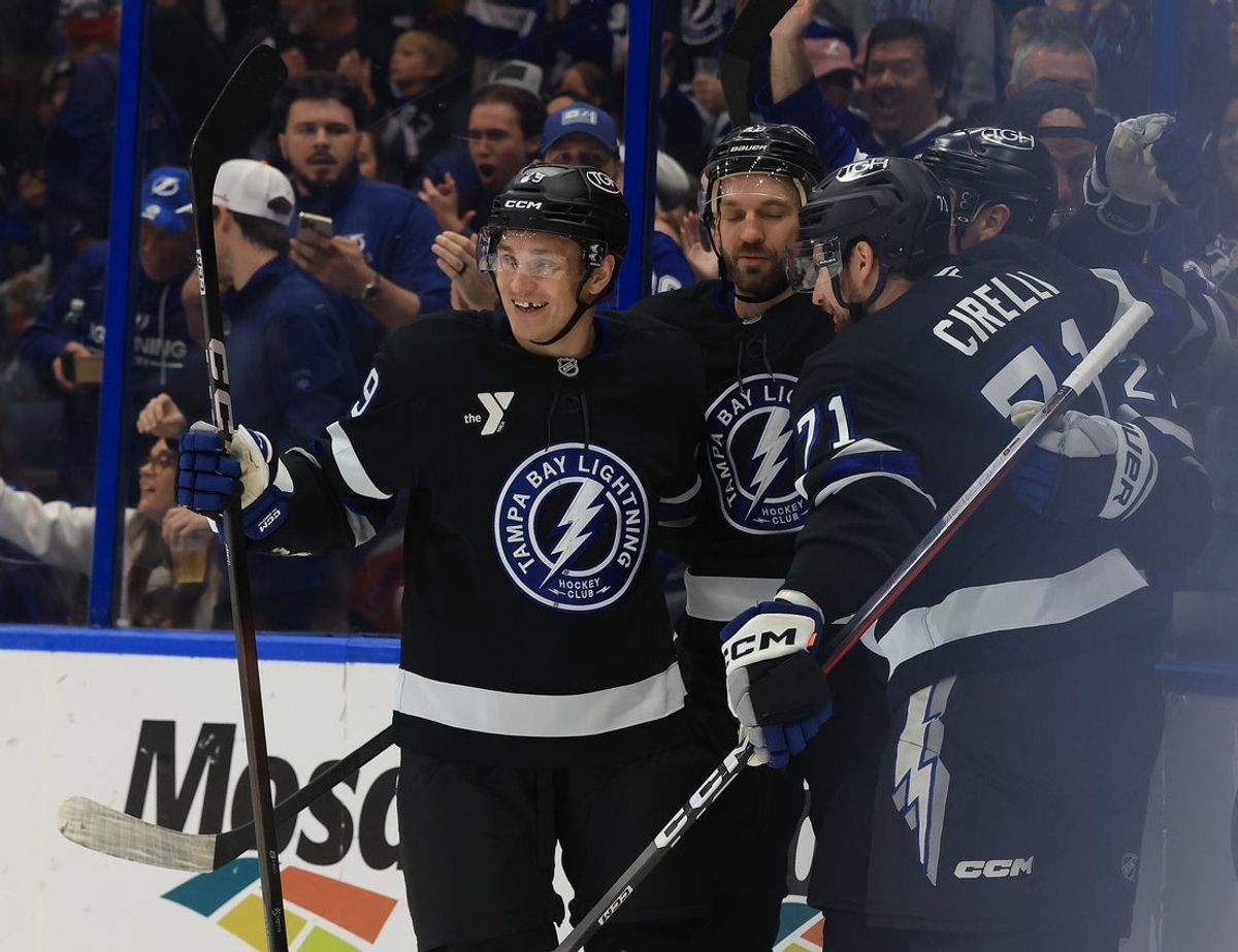 Dec 18, 2025; Tampa, Florida, USA;Tampa Bay Lightning defenseman Ryan McDonagh (27) is congratulated by teammates after scored a goal against the Carolina Hurricanes   during the third period at Benchmark International Arena. Mandatory Credit: Kim Klement Neitzel-Imagn Images