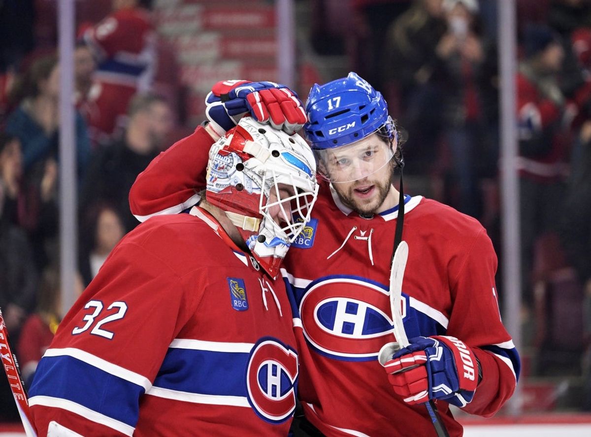 Dec 20, 2025; Montreal, Quebec, CAN; Montreal Canadiens goalie Jacob Fowler (32) and teammate forward Josh Anderson (17) celebrate the win against the Pittsburgh Penguins at the Bell Centre. Mandatory Credit: Eric Bolte-Imagn Images