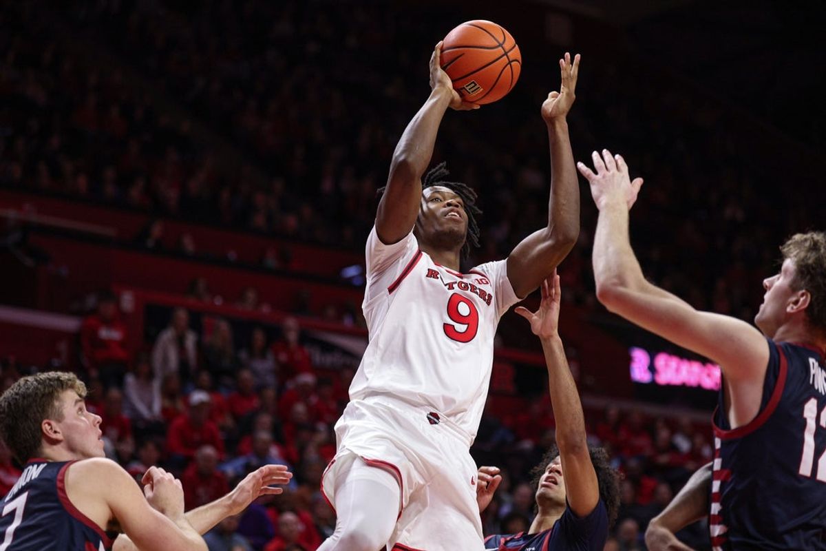 Dec 20, 2025; Piscataway, New Jersey, USA; Rutgers Scarlet Knights forward Dylan Grant (9) goes to the basket against the Penn Quakers during the second half at Jersey Mike's Arena. Mandatory Credit: Vincent Carchietta-Imagn Images