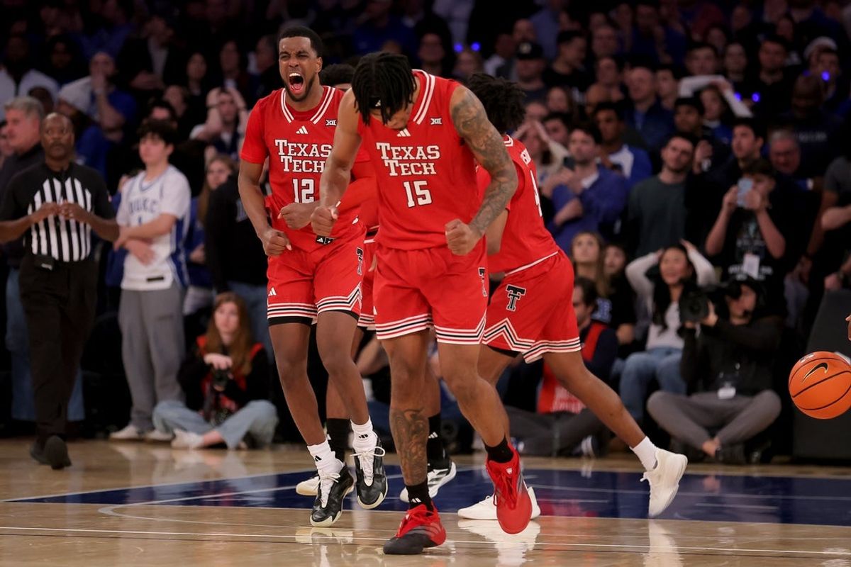Dec 20, 2025; New York, New York, USA; Texas Tech Red Raiders guard Donovan Atwell (12) and forward JT Toppin (15) celebrate after defeating the Duke Blue Devils at Madison Square Garden. Mandatory Credit: Brad Penner-Imagn Images