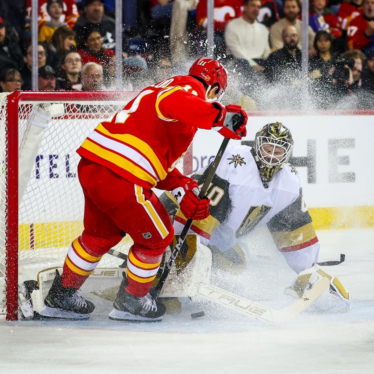 Dec 20, 2025; Calgary, Alberta, CAN; Calgary Flames center Mikael Backlund (11) scores a goal against Vegas Golden Knights goaltender Akira Schmid (40) during the second period at Scotiabank Saddledome. Mandatory Credit: Sergei Belski-Imagn Images