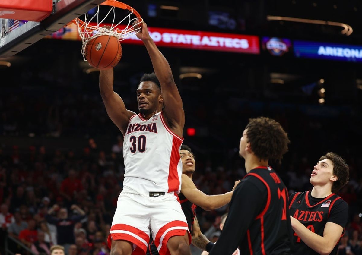 Dec 20, 2025; Phoenix, Arizona, USA; Arizona Wildcats forward Tobe Awaka (30) slam dunks the ball against the San Diego State Aztecs in the second half during the Hall of Fame Series at Mortgage Matchup Center. Mandatory Credit: Mark J. Rebilas-Imagn Images