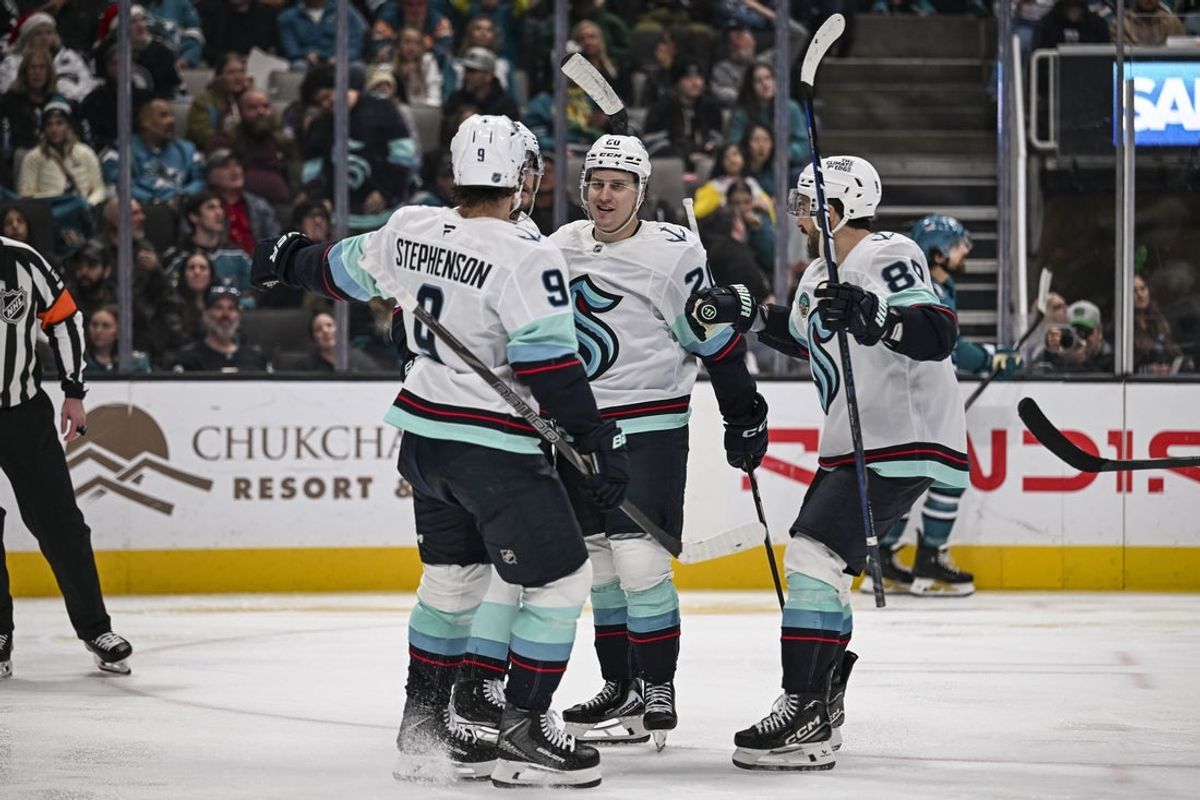Dec 20, 2025; San Jose, California, USA; The Seattle Kraken celebrate a goal by Ryan Lindgren (55) (not pictured) during the third period against the San Jose Sharks at SAP Center at San Jose. Mandatory Credit: Justine Willard-Imagn Images