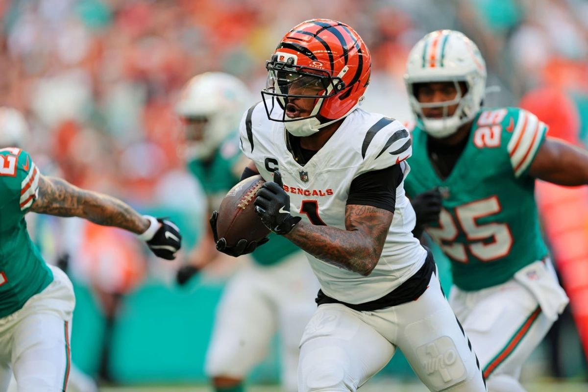 Dec 21, 2025; Miami Gardens, Florida, USA; Cincinnati Bengals wide receiver Ja'Marr Chase (1) runs the ball during the first quarter against the Miami Dolphins at Hard Rock Stadium. Mandatory Credit: Sam Navarro-Imagn Images