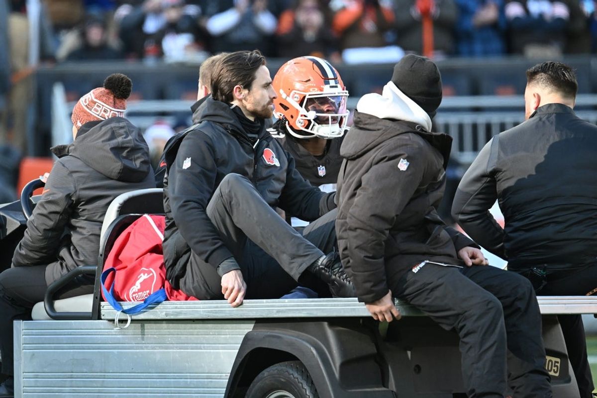 Dec 21, 2025; Cleveland, Ohio, USA;  Cleveland Browns running back Quinshon Judkins (10) is carted off the field after going down with an apparent injury against the Buffalo Bills during the first half at Huntington Bank Field. Mandatory Credit: Ken Blaze-Imagn Images