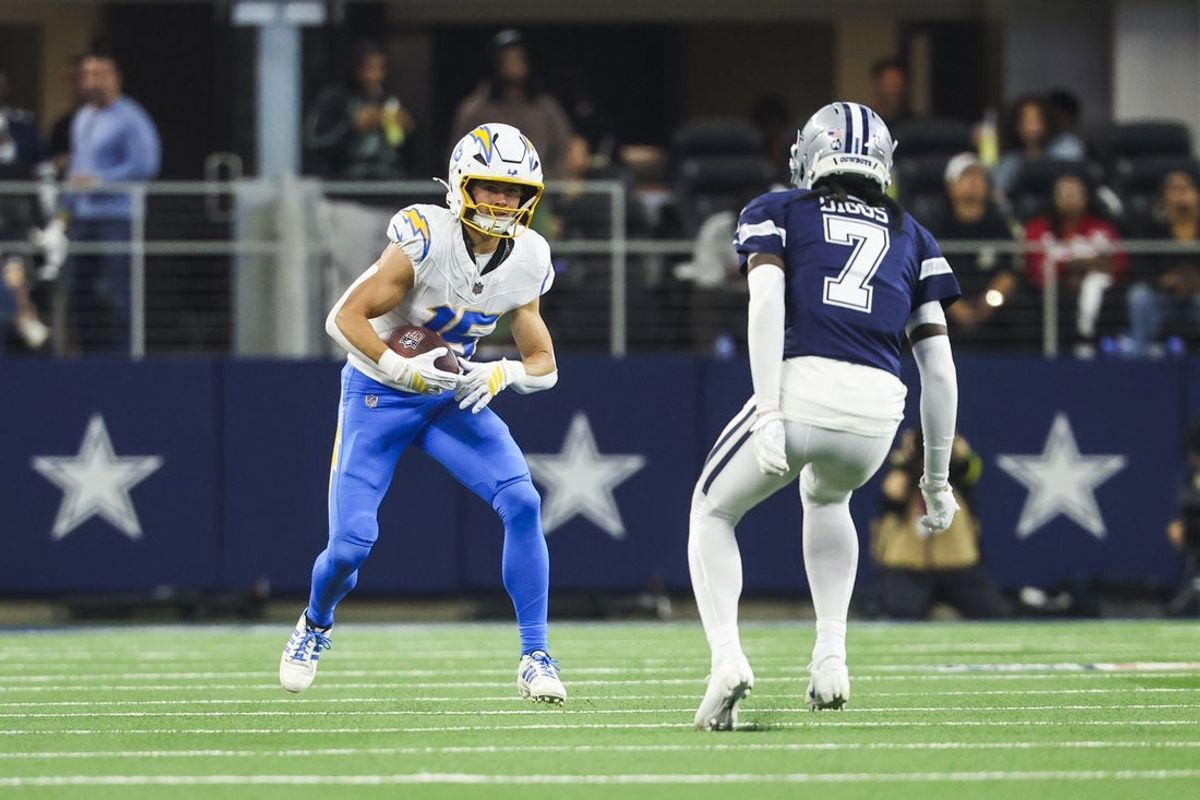 Dec 21, 2025; Arlington, Texas, USA; Los Angeles Chargers wide receiver Ladd McConkey (15) runs for yards after the catch against the Dallas Cowboys during the second quarter at AT&T Stadium. Mandatory Credit: Kevin Jairaj-Imagn Images
