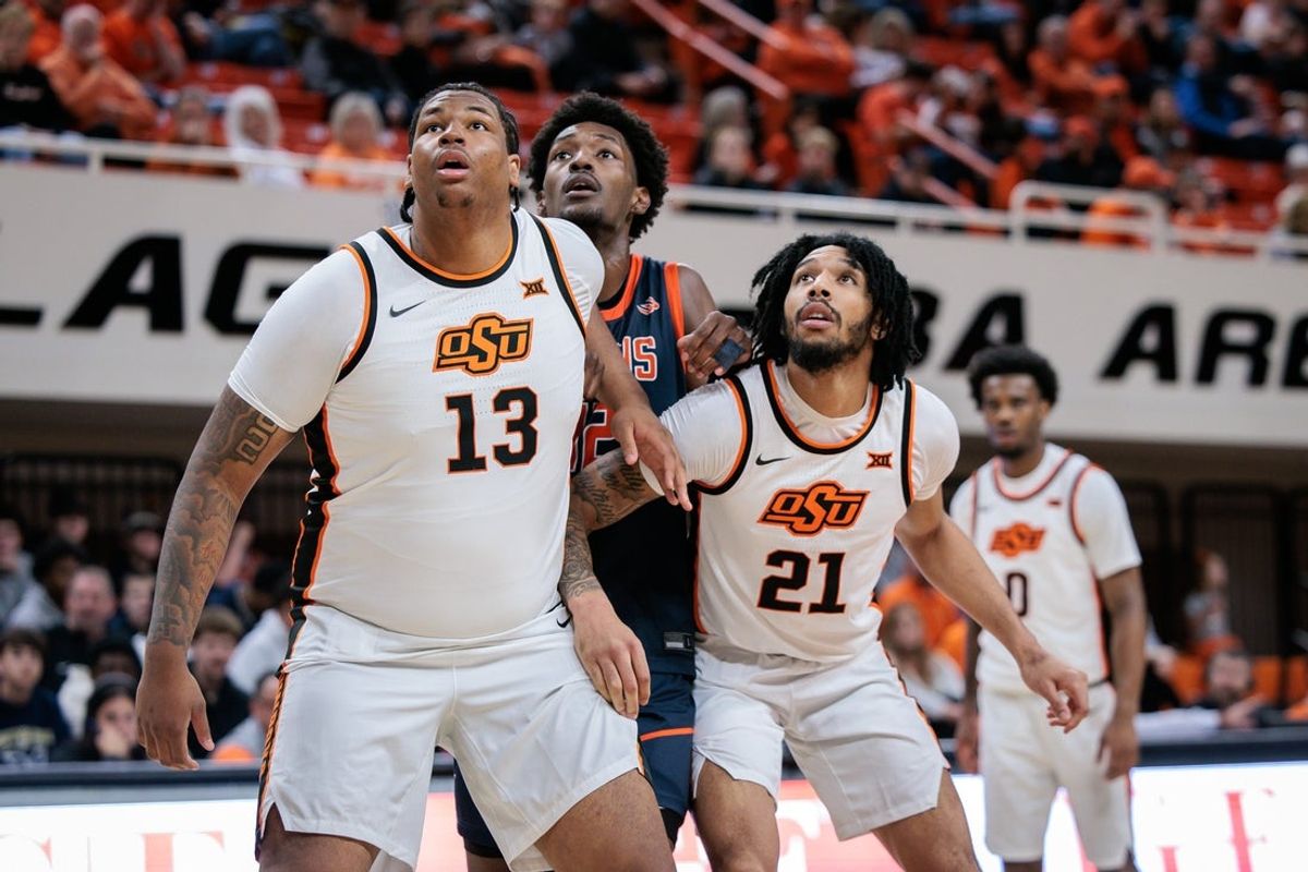Dec 21, 2025; Stillwater, Oklahoma, USA; Oklahoma State Cowboys forward Mekhi Ragland (13) and Oklahoma State Cowboys guard Isaiah Coleman (21) block out during the second half against the Cal State Fullerton Titans at Gallagher-Iba Arena. Mandatory Credit: William Purnell-Imagn Images
