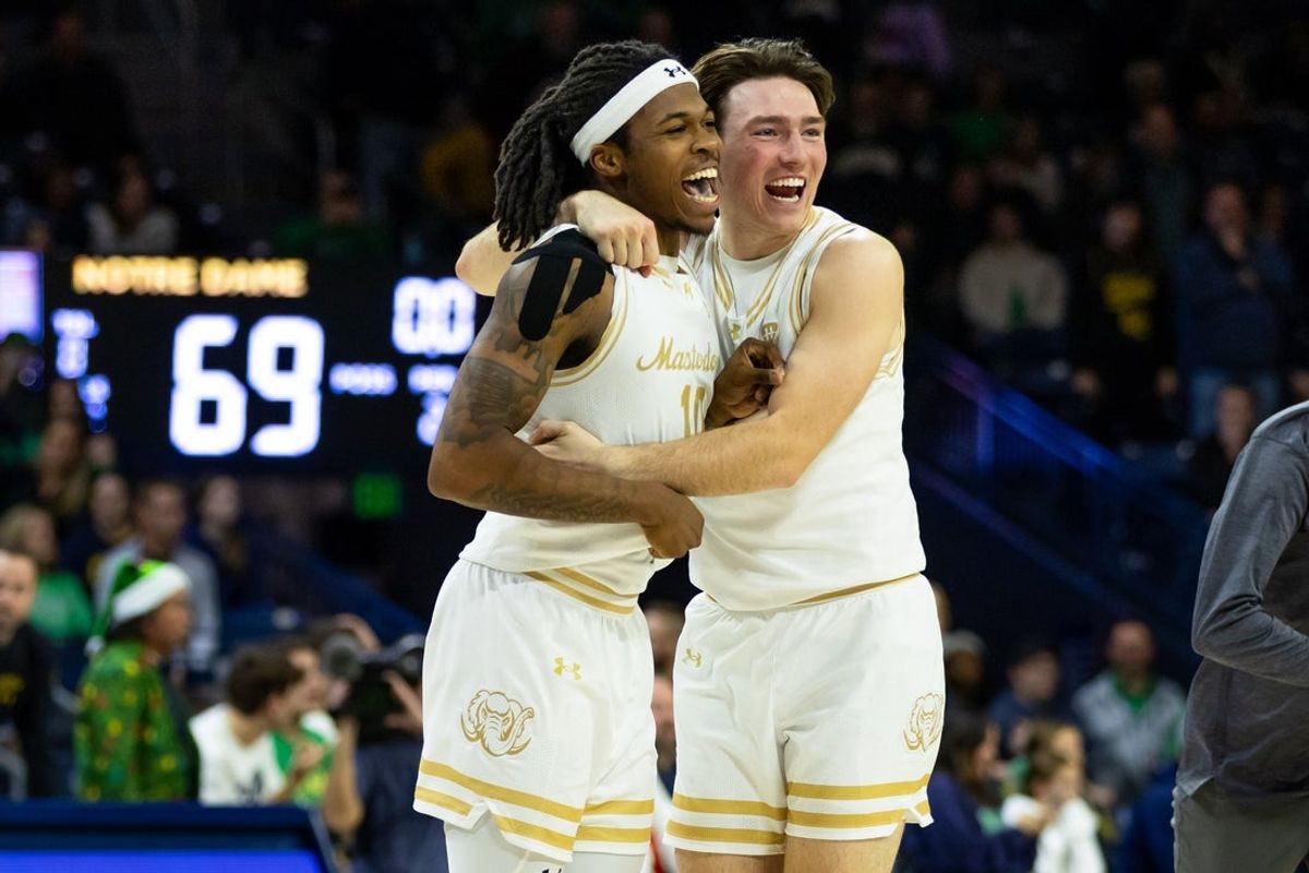 Dec 21, 2025; South Bend, Indiana, USA; Purdue Fort Wayne Mastodons guard Corey Hadnot II (10) and guard Chris Morgan (4) celebrate after beating the Notre Dame Fighting Irish during the second half at Purcell Pavilion at the Joyce Center. Mandatory Credit: Michael Caterina-Imagn Images