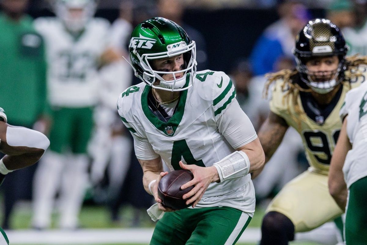 Dec 21, 2025; New Orleans, Louisiana, USA;  New York Jets quarterback Brady Cook (4) looks to hand the ball off against the New Orleans Saints during the second half  at Caesars Superdome. Mandatory Credit: Stephen Lew-Imagn Images