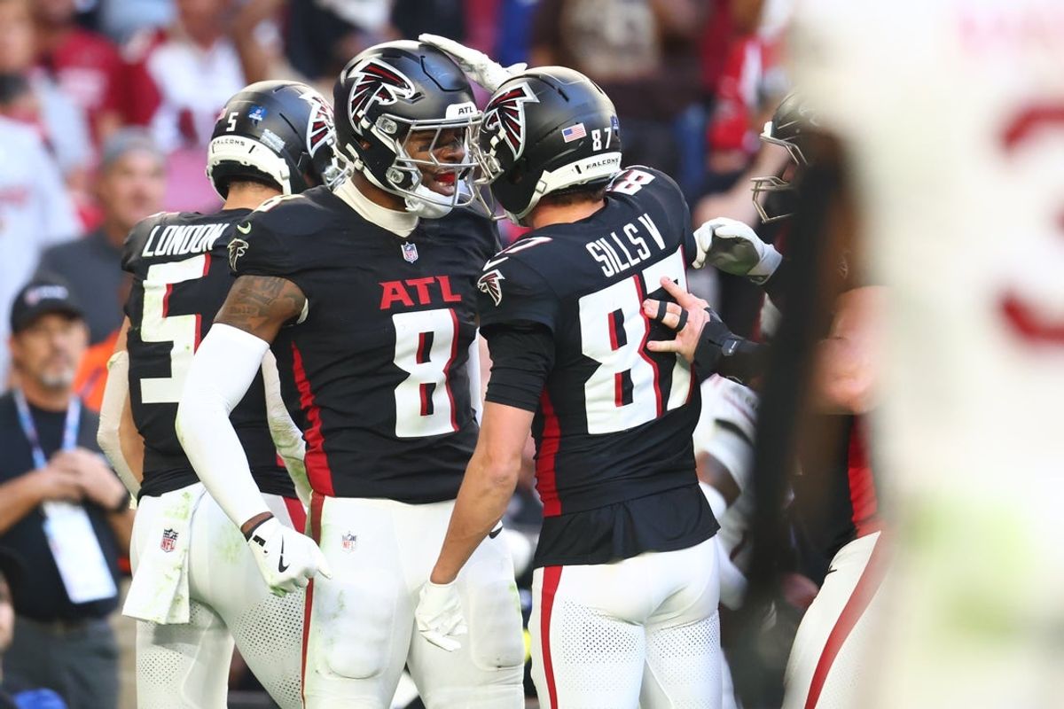 Dec 21, 2025; Glendale, Arizona, USA;  Atlanta Falcons tight end Kyle Pitts Sr. (8) reacts with wide receiver David Sills V (87) after scoring on a touchdown catch against the Arizona Cardinals during the first half at State Farm Stadium. Mandatory Credit: Mark J. Rebilas-Imagn Images