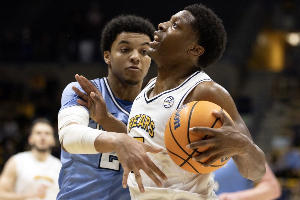 Dec 21, 2025; Berkeley, California, USA; California Golden Bears guard Dai Dai Ames (7) drives to the basket against Columbia Lions guard Miles Franklin (24) during the first half at Haas Pavilion. Mandatory Credit: D. Ross Cameron-Imagn Images