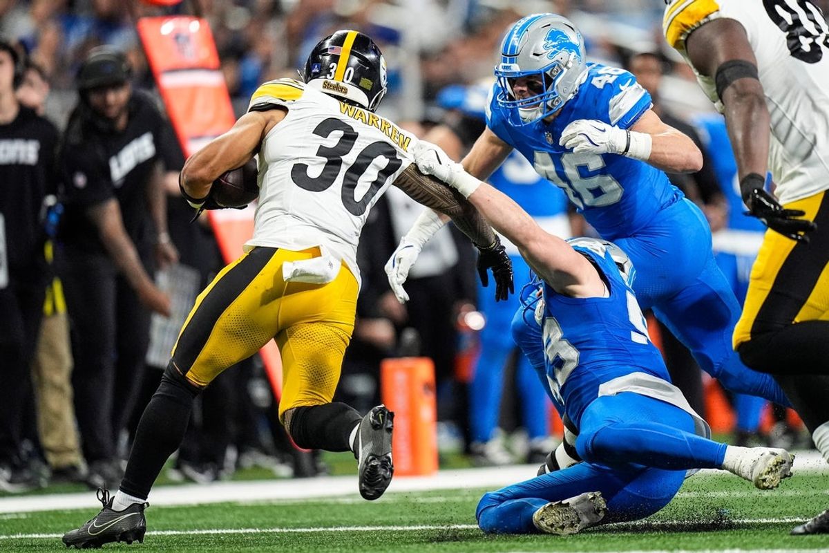 Detroit Lions linebacker Jack Campbell (46) tackles Pittsburgh Steelers running back Jaylen Warren (30) during the first half at Ford Field in Detroit on Sunday, Dec. 21, 2025.