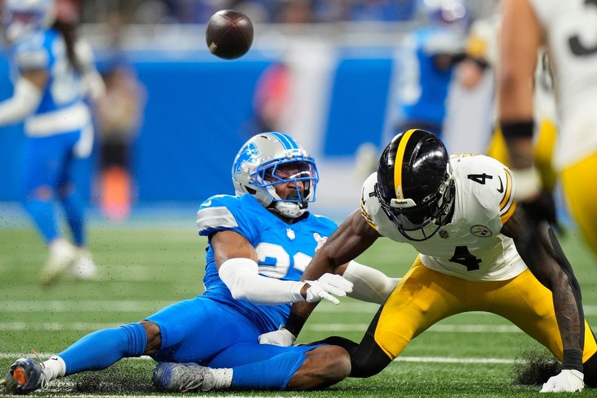 Detroit Lions cornerback Rock Ya-Sin (23) breaks up a pass intended for Pittsburgh Steelers wide receiver DK Metcalf (4) during the first half at Ford Field in Detroit on Sunday, Dec. 21, 2025.