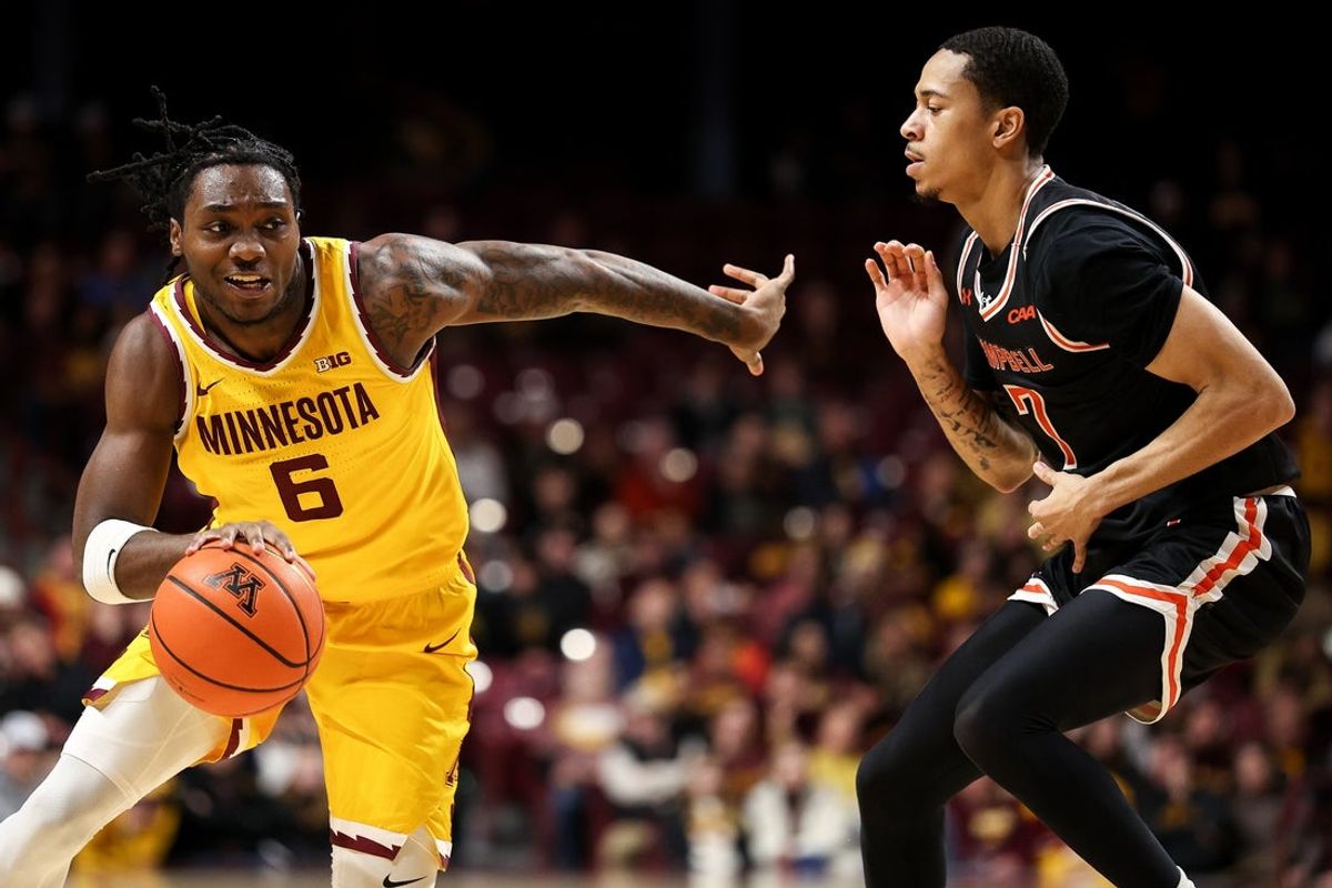 Dec 21, 2025; Minneapolis, Minnesota, USA; Minnesota Golden Gophers guard Langston Reynolds (6) works around Campbell Fighting Camels guard Cam Gregory (7) during the first half at Williams Arena. Mandatory Credit: Matt Krohn-Imagn Images
