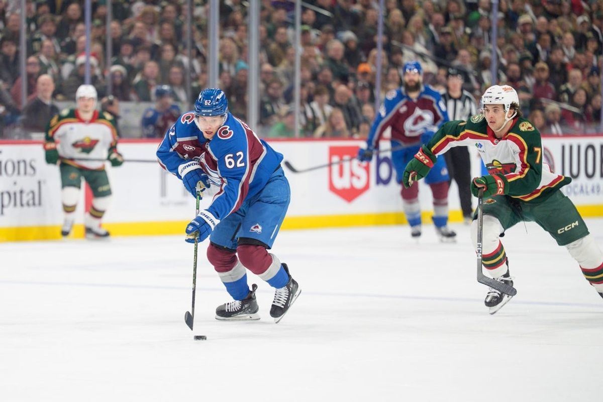 Dec 21, 2025; Saint Paul, Minnesota, USA; Colorado Avalanche left wing Artturi Lehkonen (62) is pursued by Minnesota Wild defenseman Brock Faber (7) after intercepting a pass in the first period at Grand Casino Arena. Mandatory Credit: Matt Blewett-Imagn Images