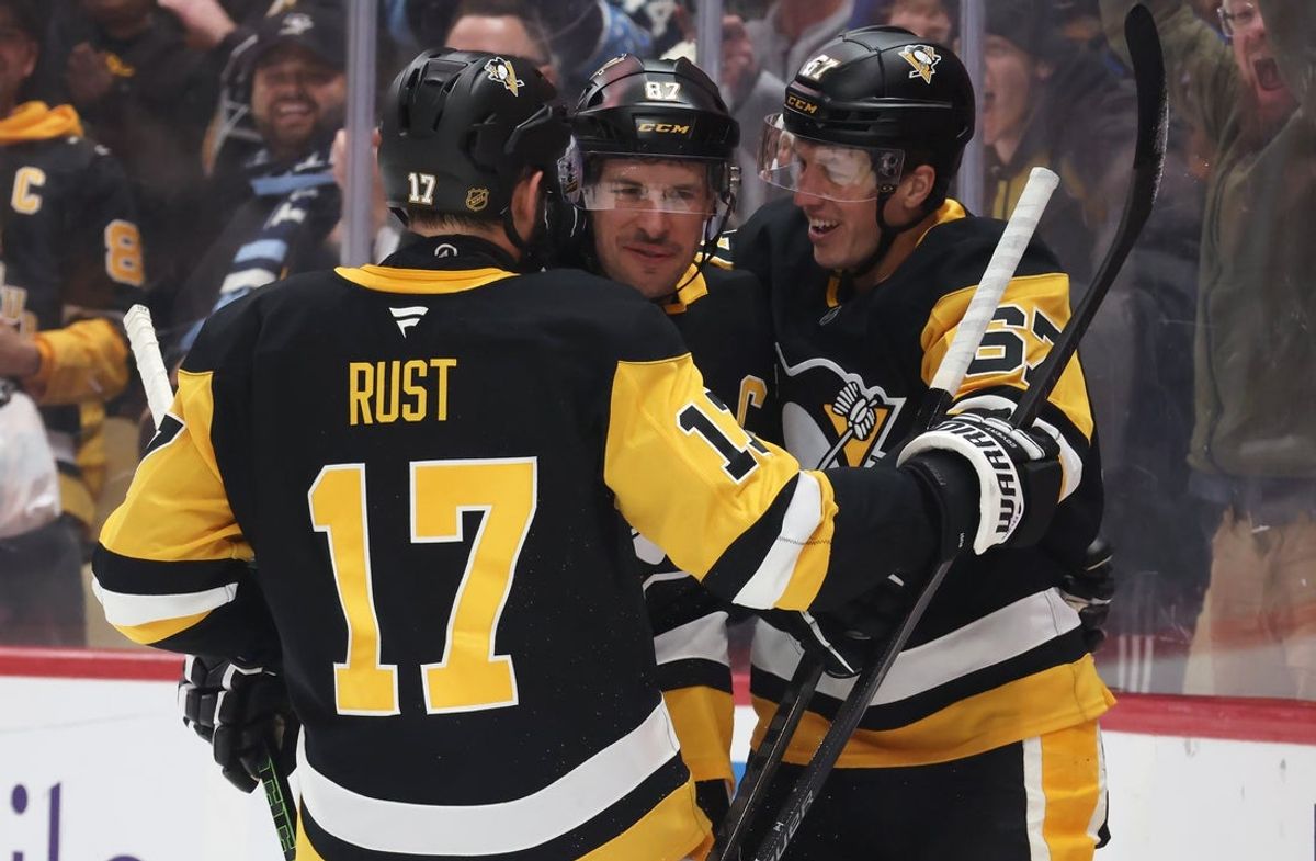 Dec 21, 2025; Pittsburgh, Pennsylvania, USA;  Pittsburgh Penguins right wing Bryan Rust (17) and Pittsburgh Penguins right wing Rickard Rakell (67) congratulate center Sidney Crosby (87) on his assist against the Montréal Canadiens to set the Penguins franchise record for career points with 1724 points during the first period at PPG Paints Arena. Mandatory Credit: Charles LeClaire-Imagn Images