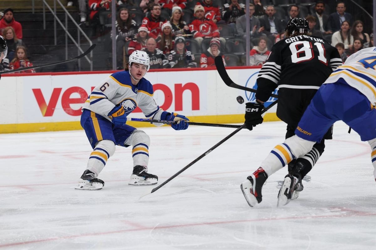 Dec 21, 2025; Newark, New Jersey, USA;  Buffalo Sabres left wing Zach Benson (6) tracks the puck against the New Jersey Devils during the first period at Prudential Center. Mandatory Credit: Thomas Salus-Imagn Images