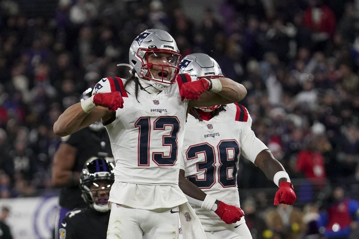 Dec 21, 2025; Baltimore, Maryland, USA;  New England Patriots wide receiver Mack Hollins (13) celebrates a catch against Baltimore Ravens safety Kyle Hamilton (14) with New England Patriots running back Rhamondre Stevenson (38) during the first half of the game at M&T Bank Stadium. Mandatory Credit: James Lang-Imagn Images