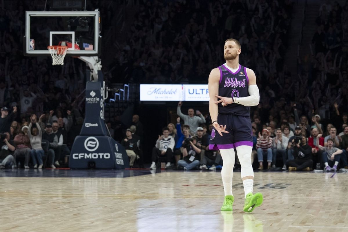Dec 21, 2025; Minneapolis, Minnesota, USA; Minnesota Timberwolves guard Donte Divincenzo (0) celebrates making a three point shot against the Milwaukee Bucks in the second half at Target Center. Mandatory Credit: Jesse Johnson-Imagn Images