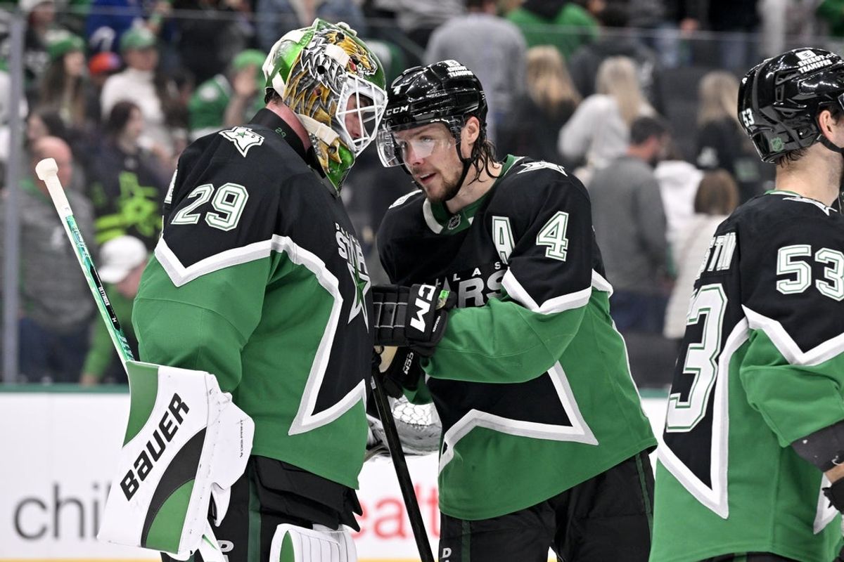 Dec 21, 2025; Dallas, Texas, USA; Dallas Stars goaltender Jake Oettinger (29) and defenseman Miro Heiskanen (4) celebrate the victory over the Toronto Maple Leafs at the American Airlines Center. Mandatory Credit: Jerome Miron-Imagn Images