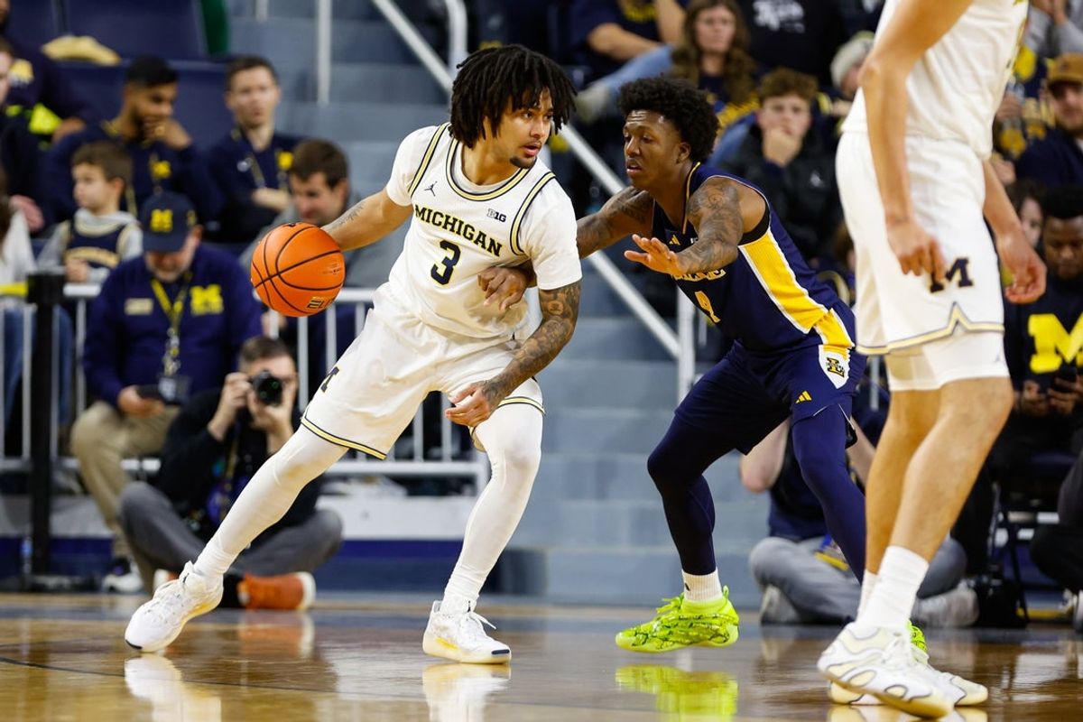 Dec 21, 2025; Ann Arbor, Michigan, USA; Michigan Wolverines guard Elliot Cadeau (3) handles the ball against La Salle Explorers guard Truth Harris (4) during the second half at Crisler Center. Mandatory Credit: Brian Bradshaw Sevald-Imagn Images