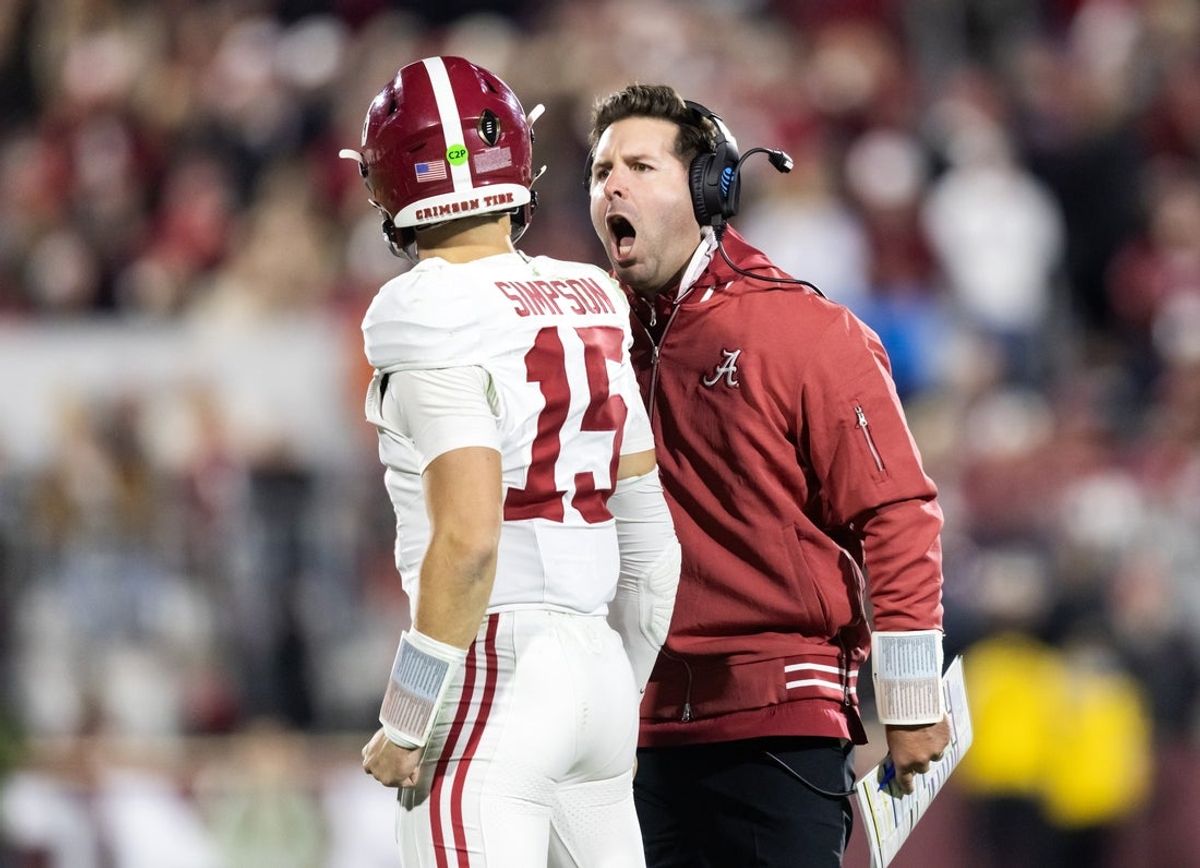 Dec 19, 2025; Norman, OK, USA; Alabama Crimson Tide quarterbacks coach Nick Sheridan with quarterback Ty Simpson (15) against the Oklahoma Sooners during the CFP National Playoff First Round at Gaylord Family Oklahoma Memorial Stadium. Mandatory Credit: Mark J. Rebilas-Imagn Images