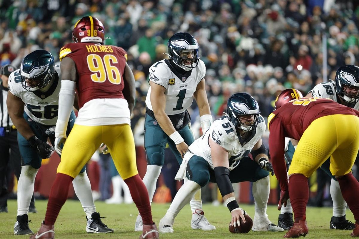 Dec 20, 2025; Landover, Maryland, USA; Philadelphia Eagles quarterback Jalen Hurts (1) prepares for a snap against the Washington Commanders during the second half at Northwest Stadium. Mandatory Credit: Amber Searls-Imagn Images