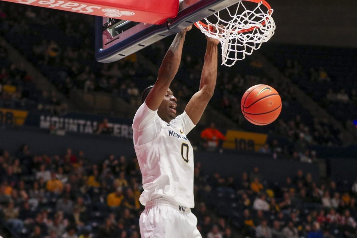 Dec 22, 2025; Morgantown, West Virginia, USA; West Virginia Mountaineers forward Brenen Lorient (0) dunks the ball during the second half against the Mississippi Valley State Delta Devils at Hope Coliseum. Mandatory Credit: Ben Queen-Imagn Images