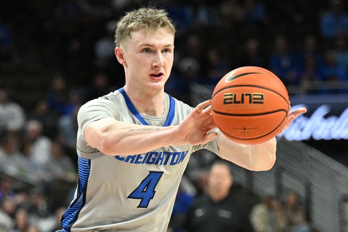 Dec 22, 2025; Omaha, Nebraska, USA;  Creighton Bluejays guard Josh Dix (4) passes against the Utah Tech Trailblazers during the second half at CHI Health Center Omaha. Mandatory Credit: Steven Branscombe-Imagn Images