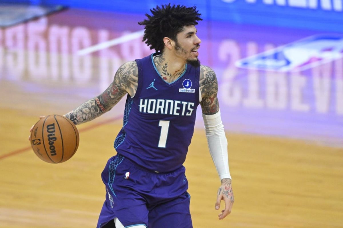 Dec 22, 2025; Cleveland, Ohio, USA; Charlotte Hornets guard Lamelo Ball (1) brings the ball up court in the fourth quarter against the Cleveland Cavaliers at Rocket Arena. Mandatory Credit: David Richard-Imagn Images