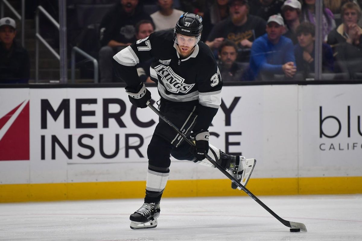 Dec 22, 2025; Los Angeles, California, USA; Los Angeles Kings left wing Warren Foegele (37) shoots on goal against the Columbus Blue Jackets during the second period at Crypto.com Arena. Mandatory Credit: Gary A. Vasquez-Imagn Images