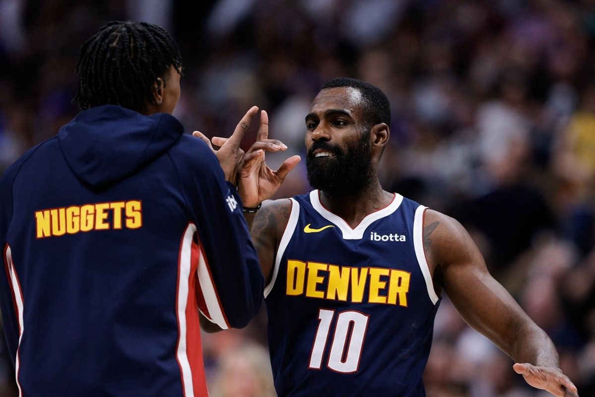 Dec 22, 2025; Denver, Colorado, USA; Denver Nuggets guard Tim Hardaway Jr. (10) celebrates with guard Peyton Watson (8) in the fourth quarter against the Utah Jazz at Ball Arena. Mandatory Credit: Isaiah J. Downing-Imagn Images