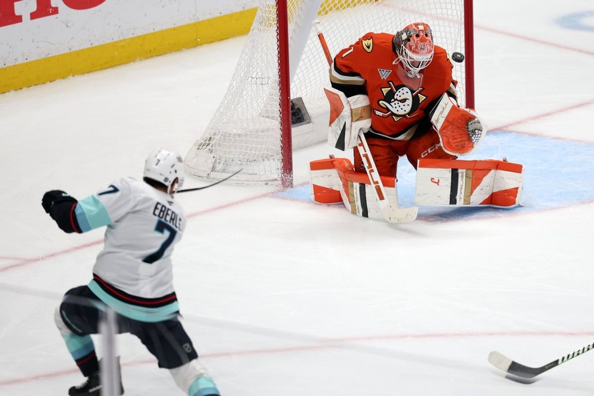 Dec 22, 2025; Anaheim, California, USA;  Seattle Kraken right wing Jordan Eberle (7) scores a goal against Anaheim Ducks goaltender Lukas Dostal (1) during the third period at Honda Center. Mandatory Credit: Kiyoshi Mio-Imagn Images