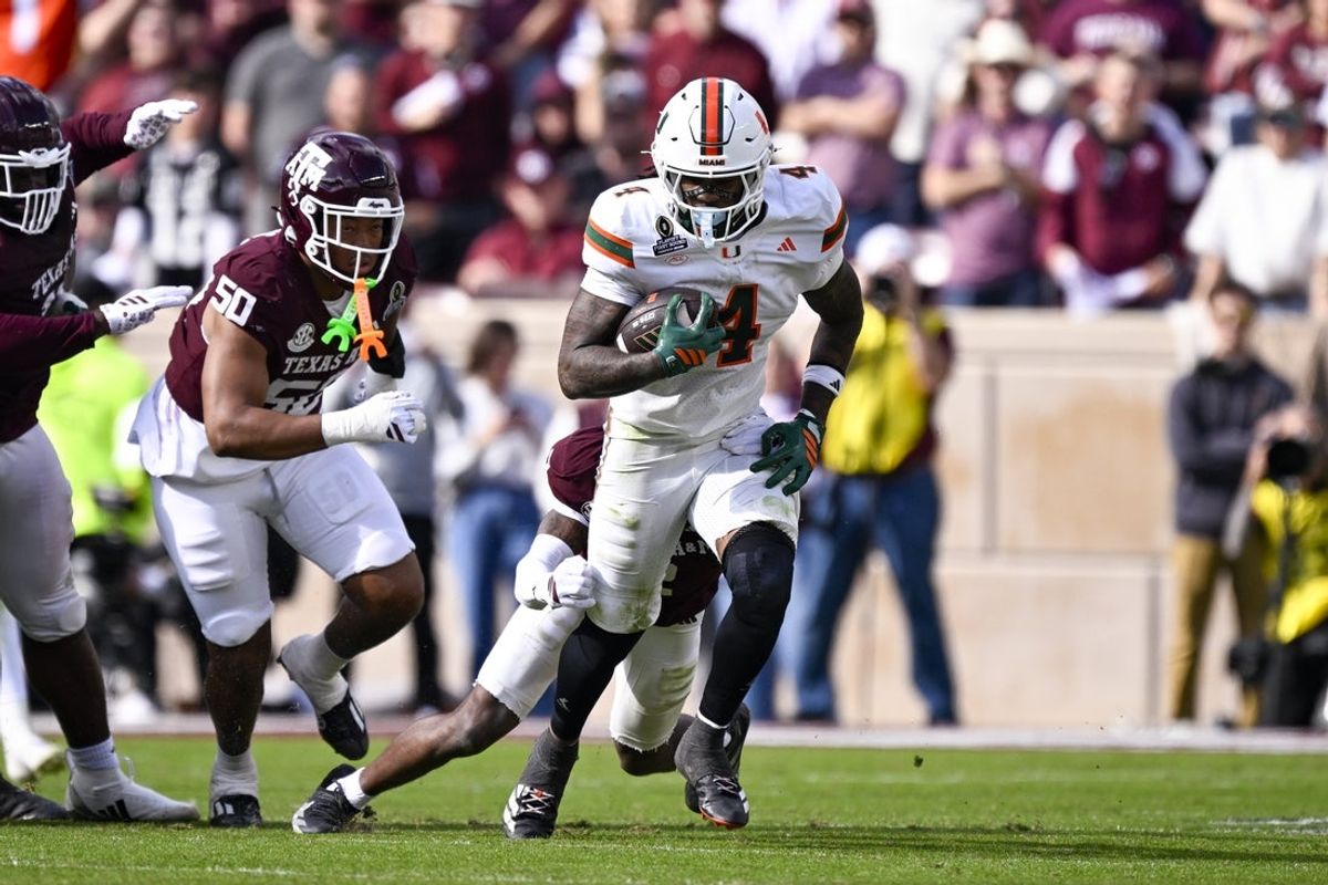 Dec 20, 2025; College Station, TX, USA; Miami Hurricanes running back Mark Fletcher Jr. (4) runs with the ball during the game between the Aggies and the Hurricanes at Kyle Field. Mandatory Credit: Jerome Miron-Imagn Images