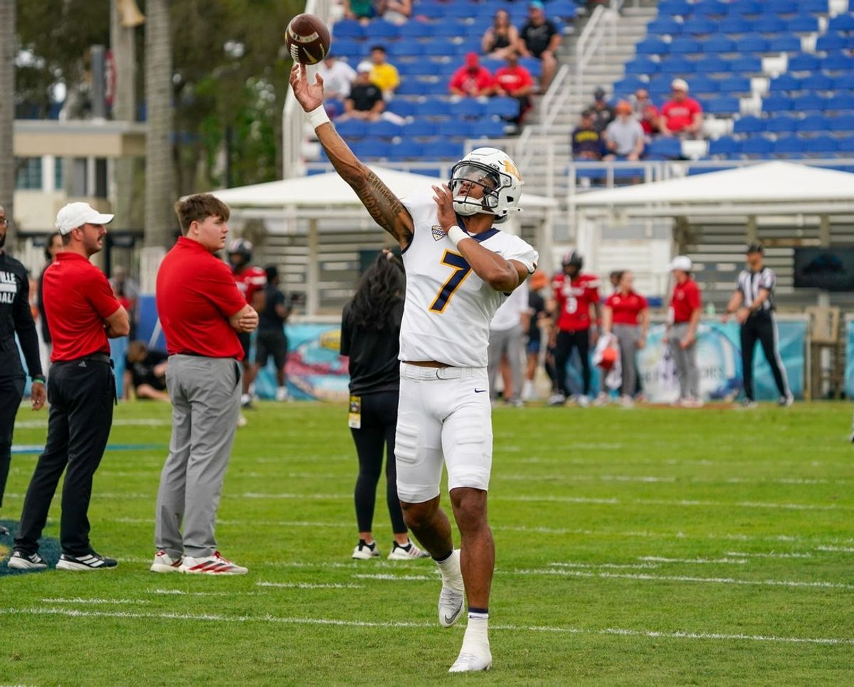 Dec 23, 2025; Boca Raton, FL, USA; Toledo Rockets quarterback Kalieb Osborne (7) warms up before the Boca Raton Bowl against the Louisville Cardinals at Flagler CU Stadium. Mandatory Credit: Jeff Romance-Imagn Images