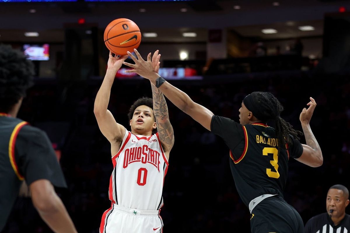 Dec 23, 2025; Columbus, Ohio, USA; Ohio State Buckeyes guard John Mobley Jr. (0) shoots a three point basket as Grambling State Tigers forward Rickey Ballard (3) defends  during the second half at Value City Arena. Mandatory Credit: Joseph Maiorana-Imagn Images