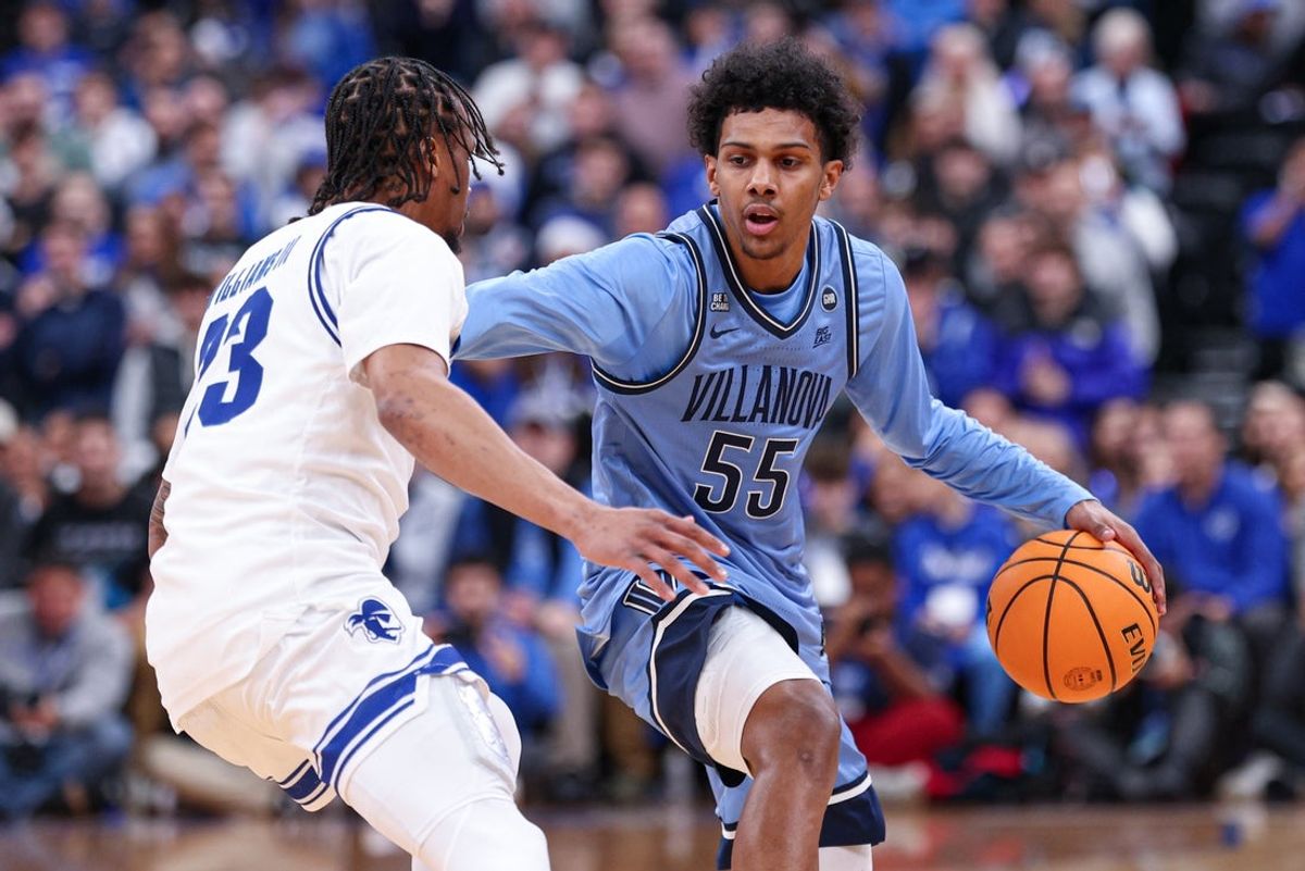 Dec 23, 2025; Newark, New Jersey, USA; Villanova Wildcats guard Acaden Lewis (55) dribbles against Seton Hall Pirates guard Mike Williams III (23) during the first half at Prudential Center. Mandatory Credit: Vincent Carchietta-Imagn Images