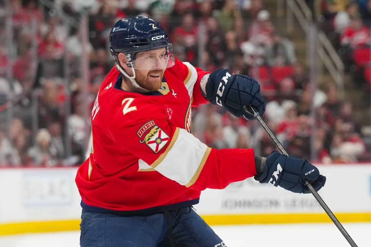 Dec 23, 2025; Raleigh, North Carolina, USA;  Florida Panthers defenseman Jeff Petry (2) takes a shot against the Carolina Hurricanes during the second period at Lenovo Center. Mandatory Credit: James Guillory-Imagn Images