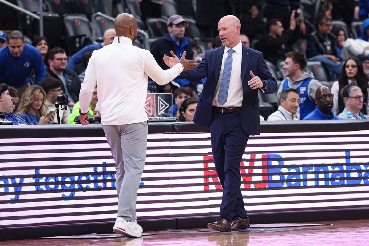 Dec 23, 2025; Newark, New Jersey, USA; Seton Hall Pirates head coach Shaheen Holloway, left, shakes hands with Villanova Wildcats head coach Kevin Willard after the game at Prudential Center. Mandatory Credit: Vincent Carchietta-Imagn Images